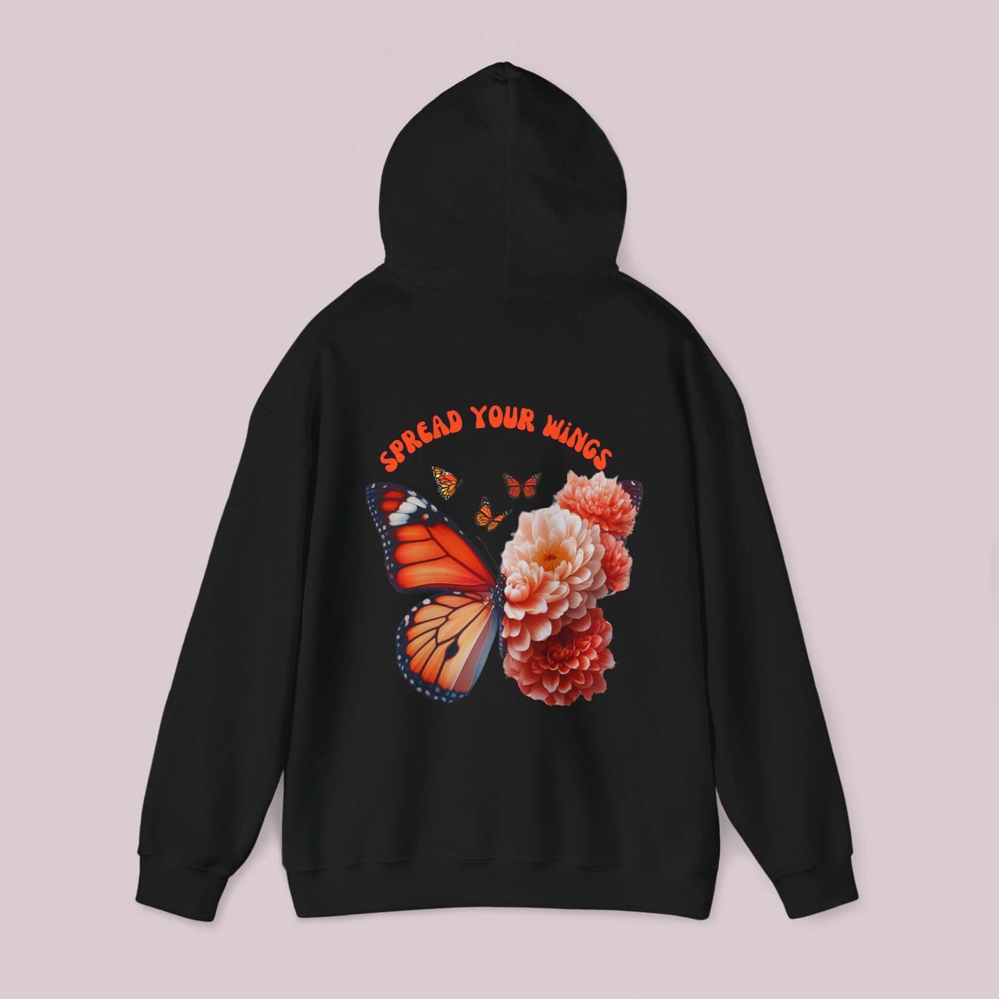 Black hoodie featuring "Spread Your Wings" design with a butterfly and vibrant flowers on the back for comfort and style.