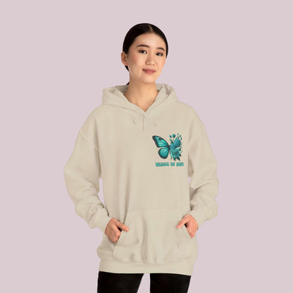 Woman wearing "Wings Of Hope" Butterfly and Flowers Hoodie, featuring a butterfly and floral design on soft, high-quality fabric.